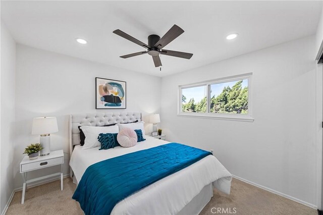 carpeted bedroom with ceiling fan