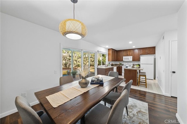 dining space featuring dark hardwood / wood-style flooring