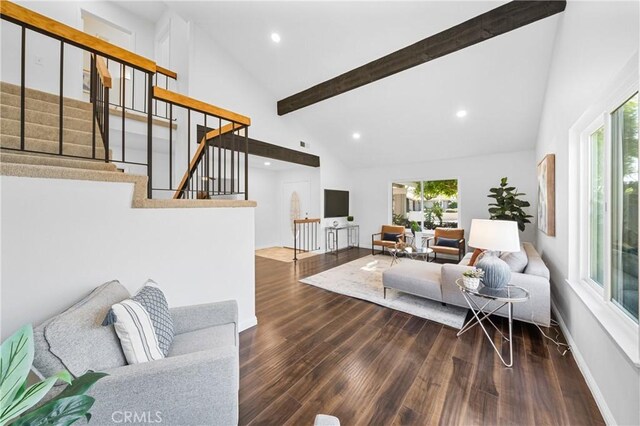 living room featuring high vaulted ceiling, dark hardwood / wood-style floors, and beam ceiling