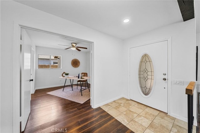 foyer entrance with ceiling fan and hardwood / wood-style floors