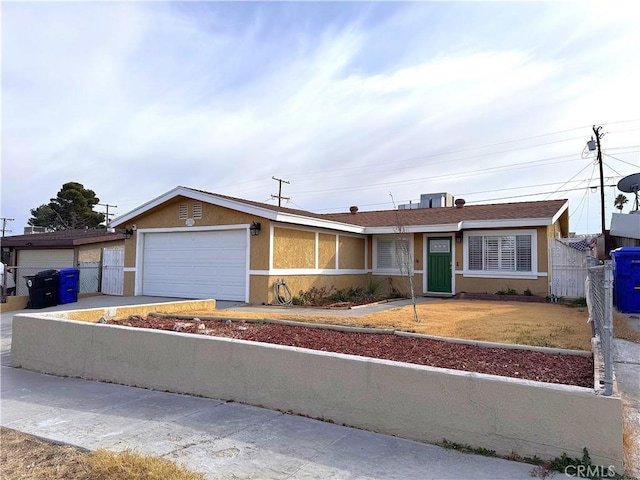 ranch-style house featuring a garage