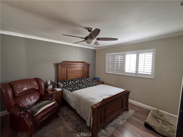 bedroom with ornamental molding, dark hardwood / wood-style floors, and ceiling fan