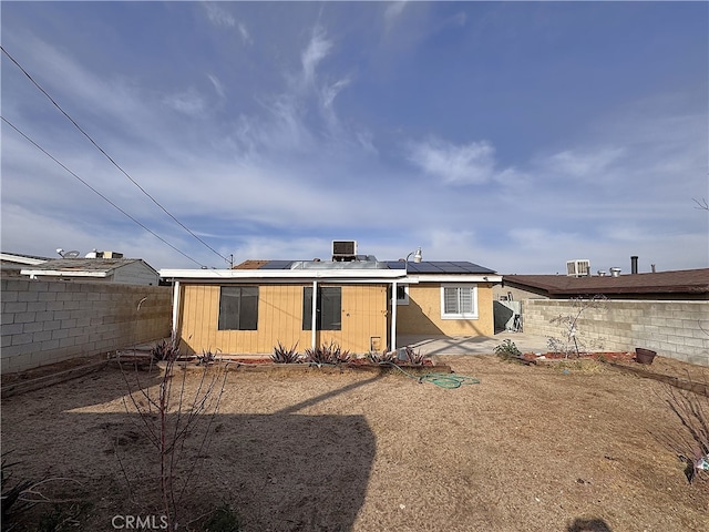 back of property with solar panels