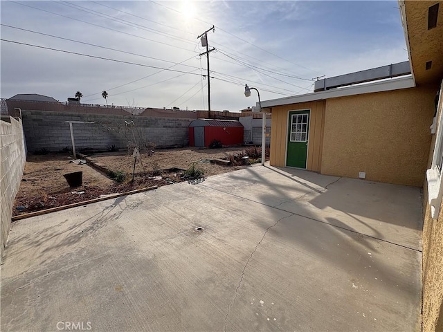 view of patio featuring a shed