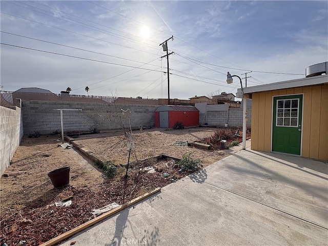 view of yard with a patio area and a shed