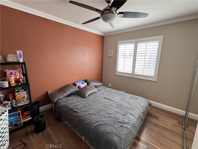1704 Sunrise Rd, Barstow, CA 92311 - bedroom featuring wood finished floors, crown molding, baseboards, and a ceiling fan
