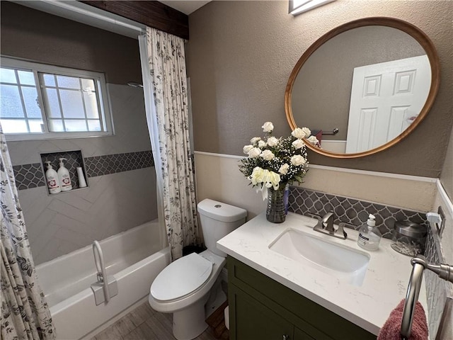 full bathroom with vanity, toilet, and shower / bath combo with shower curtain