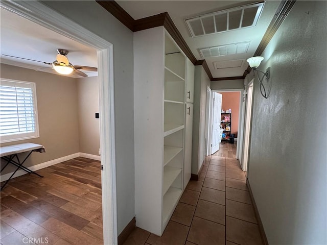 hall featuring crown molding and hardwood / wood-style floors