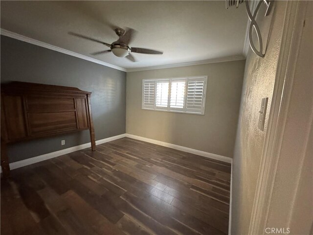 1704 Sunrise Rd, Barstow, CA 92311 - unfurnished bedroom with ornamental molding, dark wood-style flooring, baseboards, and ceiling fan