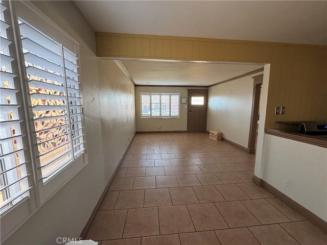 1704 Sunrise Rd, Barstow, CA 92311 - tiled spare room with baseboards and ornamental molding