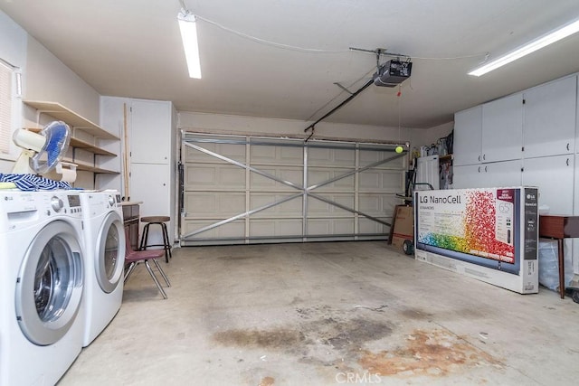 garage with a garage door opener and washing machine and clothes dryer