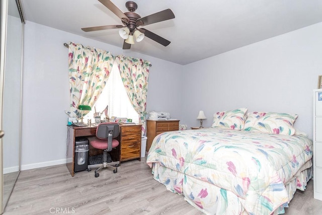 bedroom with light hardwood / wood-style flooring and ceiling fan