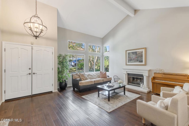 living room featuring a notable chandelier, beam ceiling, dark wood-type flooring, and high vaulted ceiling