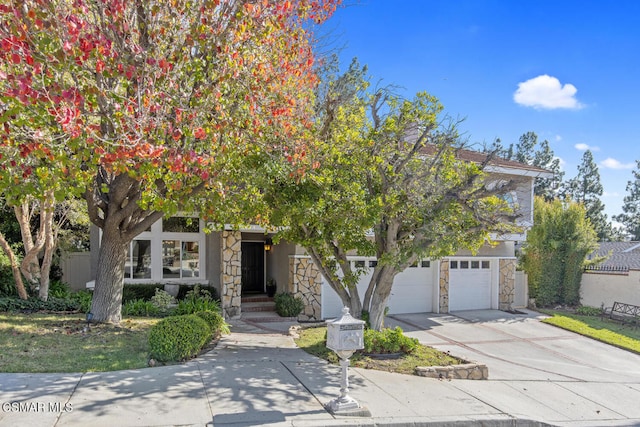 obstructed view of property featuring a garage