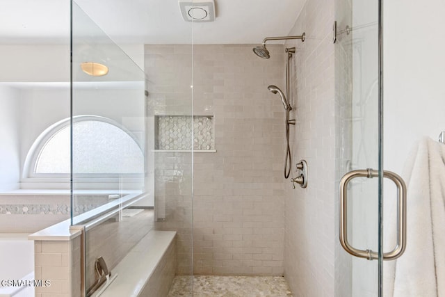 bathroom featuring an enclosed shower