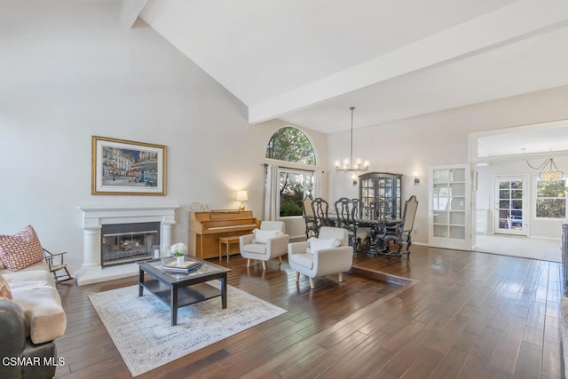 living room with an inviting chandelier, dark hardwood / wood-style flooring, high vaulted ceiling, and beamed ceiling