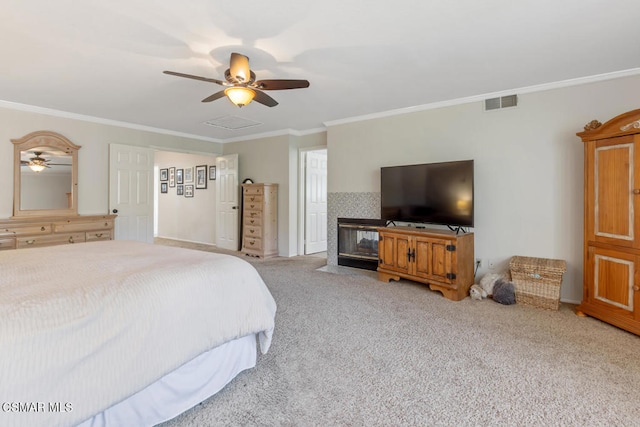 bedroom featuring light carpet, ornamental molding, and ceiling fan