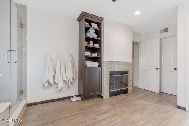 unfurnished living room featuring light wood-type flooring