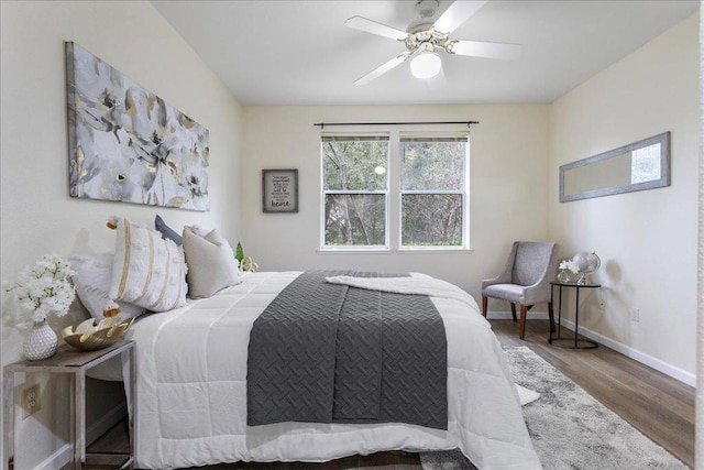 bedroom with wood-type flooring and ceiling fan