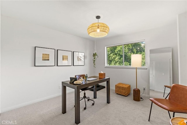 office area featuring light carpet