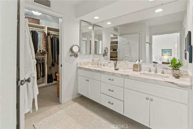 bathroom with vanity and tile patterned flooring