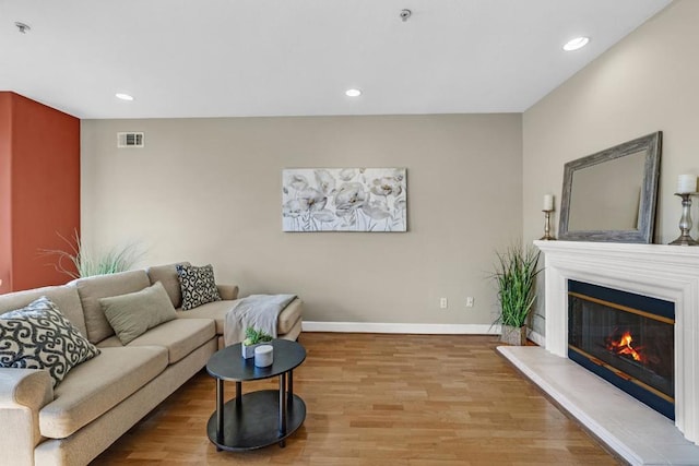 living room with light hardwood / wood-style flooring