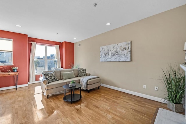 living room with light hardwood / wood-style flooring