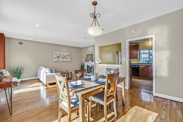 dining area with light hardwood / wood-style floors