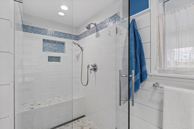 full bathroom featuring recessed lighting and a shower stall