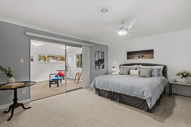 bedroom with baseboards, access to exterior, carpet flooring, and crown molding