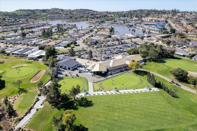 bird's eye view featuring a residential view, view of golf course, and a water view