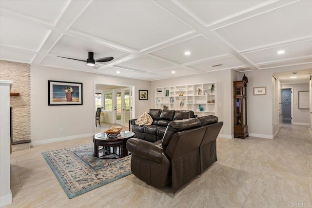 living room with french doors, baseboards, and coffered ceiling