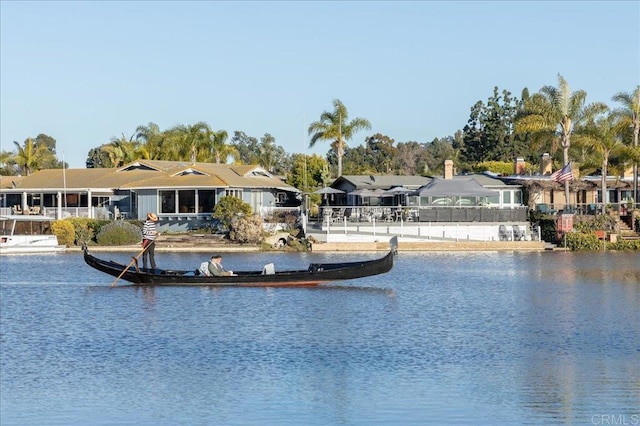 view of pool featuring a water view