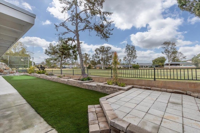 view of yard with a patio area and a fenced backyard