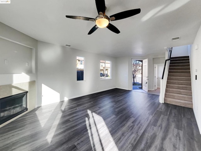 unfurnished living room featuring dark hardwood / wood-style floors