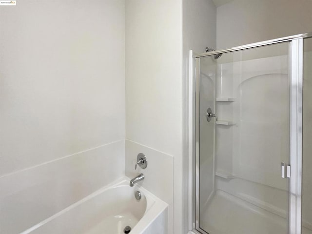 bathroom with separate shower and tub