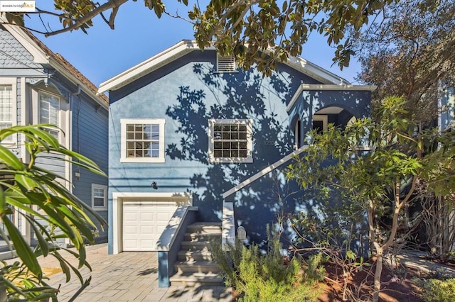 view of front of property featuring a garage