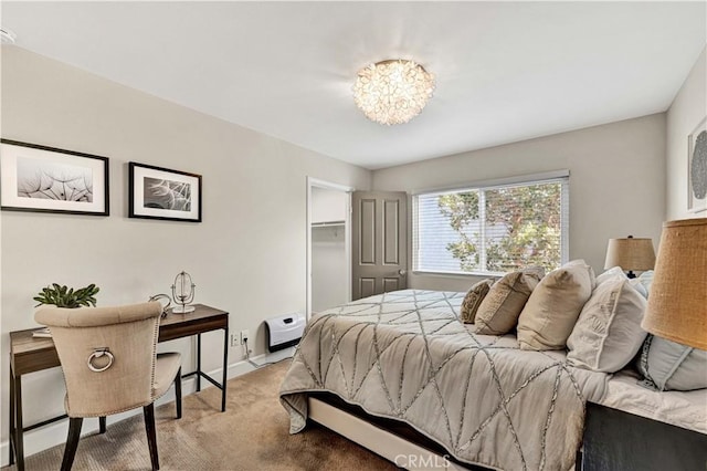 bedroom with light colored carpet and a closet