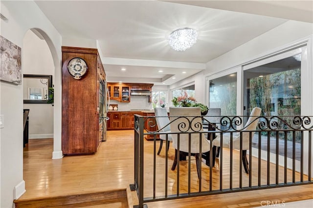 dining area with a notable chandelier and light wood-type flooring