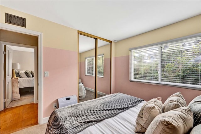 bedroom with carpet flooring and a closet