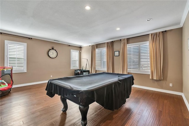 playroom featuring a wealth of natural light, wood-type flooring, and ornamental molding