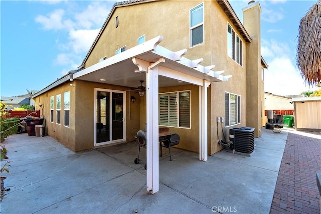 back of property featuring a patio area, ceiling fan, and central air condition unit