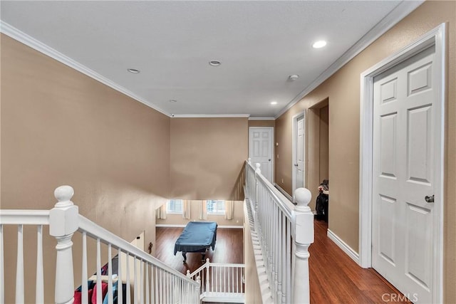 hall featuring hardwood / wood-style flooring and ornamental molding