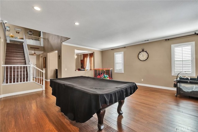 recreation room with billiards, hardwood / wood-style floors, and a wealth of natural light