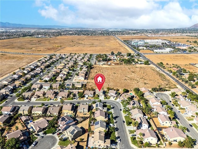 birds eye view of property featuring a mountain view