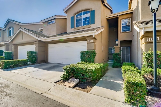 townhome / multi-family property featuring a garage