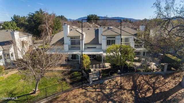 view of front of property with a mountain view