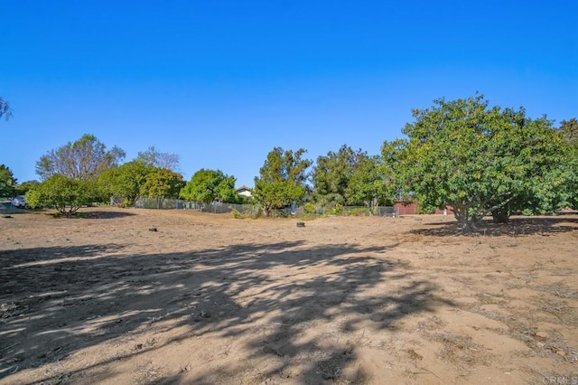 view of yard with a rural view