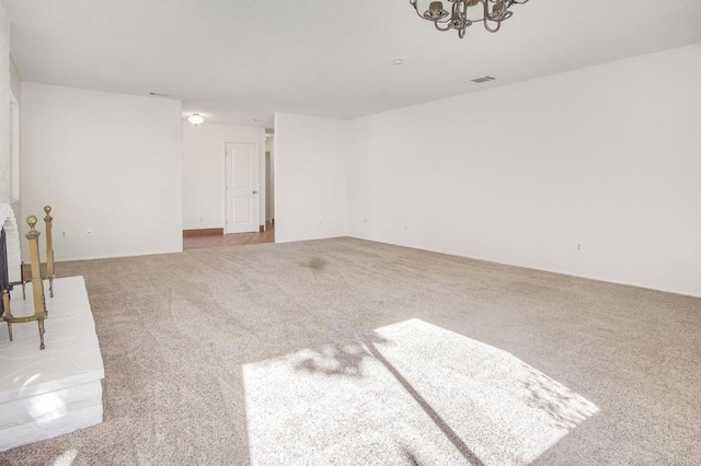 interior space with carpet flooring and a notable chandelier