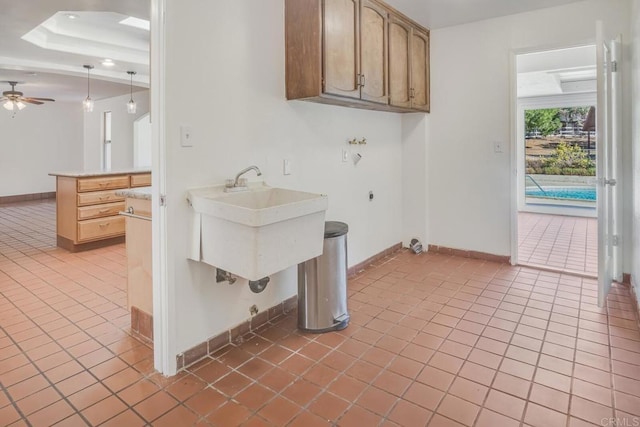 laundry area featuring cabinets, light tile patterned floors, ceiling fan, washer hookup, and hookup for an electric dryer